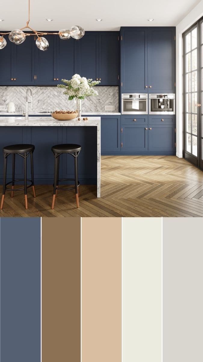 Kitchen inspiration with navy cabinetry, a white island, and wood flooring